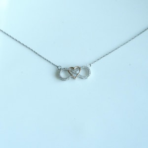 Preowned Sterling Silver Diamond Accented Infinity Pendant with Rose Gold Plated Heart