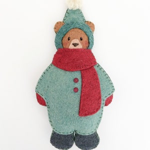 Felt christmas ornament pattern. Cute bear christmas ornament sewing pattern. Christmas sewing pattern. Bear ornament. Bear in snowsuit. Brown bear in green snowsuit with red scarf. DIY Christmas gift. Winter sewing project.