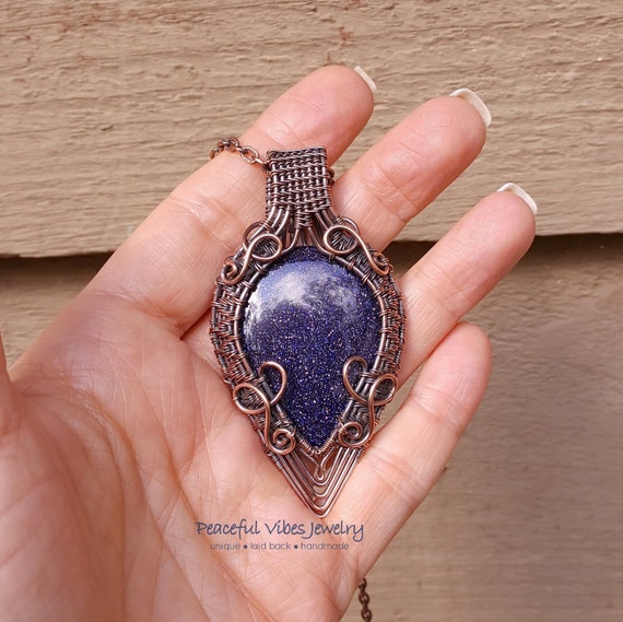 Blue goldstone wire wrapped pendant