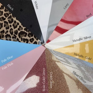 May include: A selection of vinyl colours and textures for crafting projects. The colours include black, white, grey, red, metallic silver, metallic gold, pale blue, pale pink, leopard print, rose gold glitter and silver glitter.