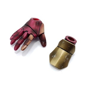 May include: Two action figure accessories, a red and gold hand and a gold forearm, both with a red plastic connector.