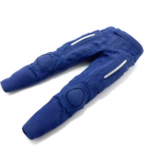 May include: Blue trousers with white accents and knee pads.