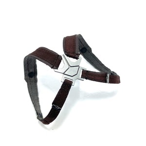 May include: A brown and gray harness with a silver metal center piece. The harness has adjustable straps and is designed to fit around the chest and shoulders. The harness is made of a durable material.