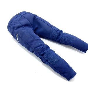 May include: A pair of blue denim trousers with white accents and knee pads.