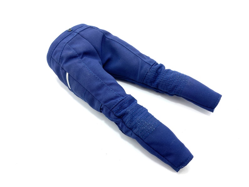 May include: A pair of blue denim trousers with white accents and knee pads.