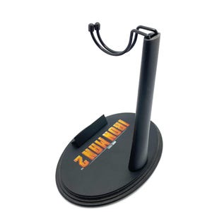May include: Black plastic action figure stand with a metal arm and a circular base. The base has the words "Iron Man 2" printed on it.