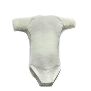 May include: A white cotton bodysuit with short sleeves. The bodysuit is made of a soft, stretchy fabric and has a simple, classic design.