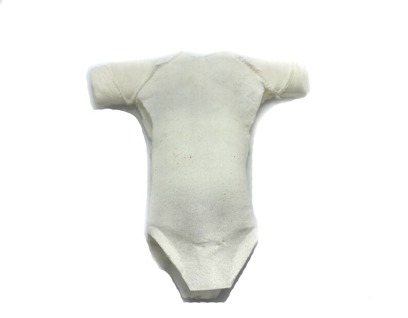 May include: A white cotton bodysuit with short sleeves. The bodysuit is made of a soft, stretchy fabric and has a simple, classic design.