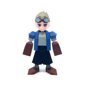 May include: A blue and gray block figure toy with brown arms and legs. The figure is wearing goggles and has a serious expression.