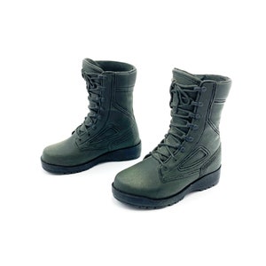 May include: A pair of dark green military-style boots with black laces. The boots have a rugged look and are made of a durable material.