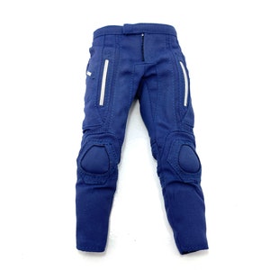 May include: Blue trousers with white accents and knee pads.
