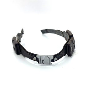 May include: A brown leather belt with a silver buckle and two pouches on the side.