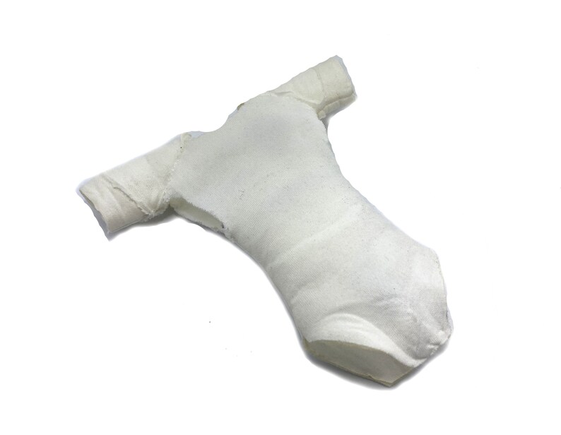 May include: A white baby onesie with short sleeves. The onesie is made of a soft, stretchy fabric and has a simple design.