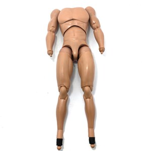 May include: Tan-colored action figure body with articulated joints. The figure has a muscular physique, with defined arms, chest, and legs. The feet have black ankle supports. The figure is designed to be customizable.
