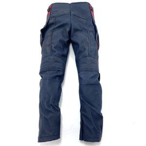 May include: A pair of dark blue trousers with red accents. The trousers have a textured fabric and multiple pockets.