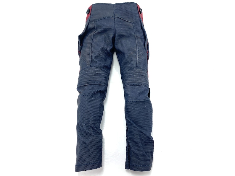 May include: A pair of dark blue trousers with red accents. The trousers have a textured fabric and multiple pockets.