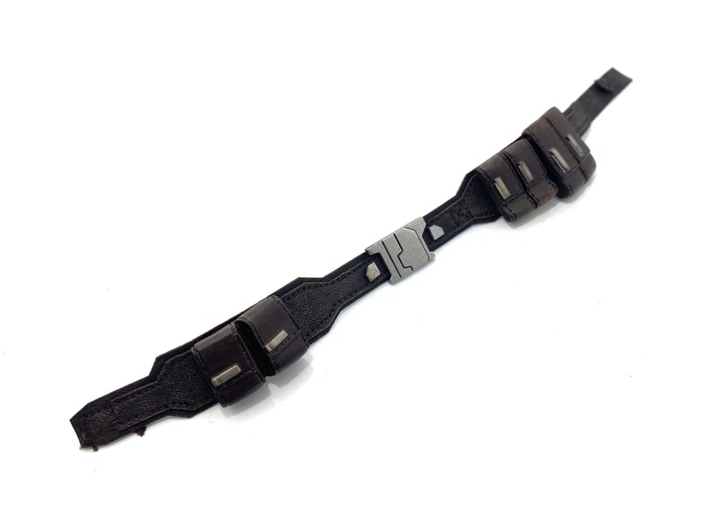 May include: A brown leather belt with a silver buckle and two pouches on each side.
