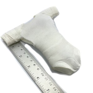 May include: A white leotard with short sleeves. The leotard is made of a soft, stretchy fabric and has a simple, classic design.