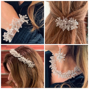 May include: A set of silver jewelry featuring a delicate, crystal-like design. The set includes a bracelet, a headband, a hair clip, and a necklace with matching earrings.