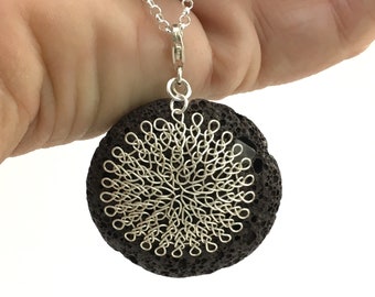 brown lava stone pendant with finger knitted silver plated flower