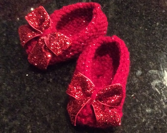 Ruby red slipper booties for your newborn, because there’s no place like home.