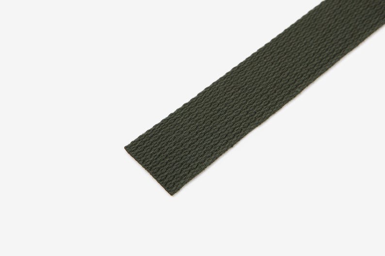 May include: A dark green woven webbing strap.
