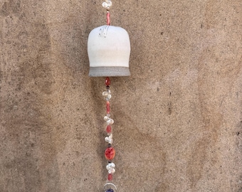 Handmade white carved Ceramic Bell with coral quartz crystals and white coin freshwater pearls