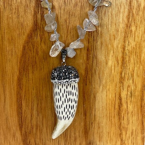 Horn Carved Pendant 2 1/8 inch tall with Silver cap imbedded with Marcasites. Rutilated quartz hand knotted long necklace 38 inches long