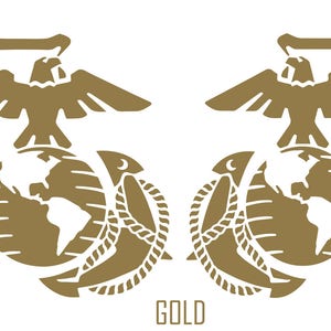 May include: A gold-coloured emblem featuring a globe with a stylised eagle perched on top. The globe is surrounded by a rope-like design and an anchor. The text "GOLD" is printed below the emblem.