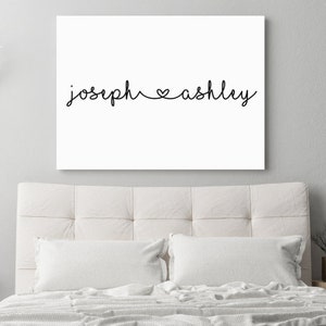 May include: White canvas print with the text "joseph ♥ ashley" in black cursive font.