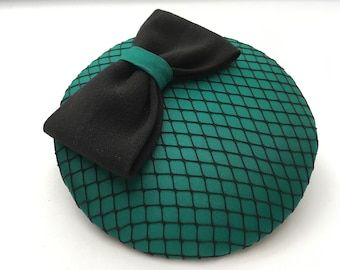 elegant green fascinator, black bow and hat net