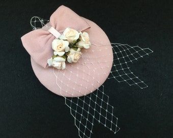 Pink fascinator with bow, rose buds, veil, playful, festive