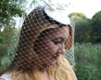 Wedding fascinator with veil and pearls for the bride