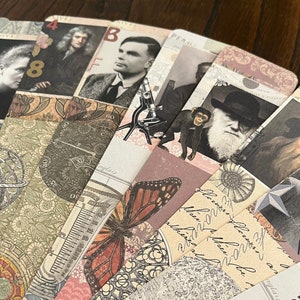 May include: A collection of vintage-style bookmarks featuring images of scientists, a butterfly, a microscope, and a compass. The bookmarks are decorated with intricate patterns and text, including the words "aglais" and "Michael Faraday".
