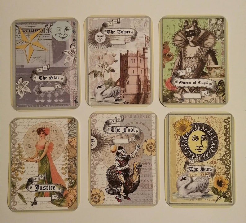 May include: A set of ten tarot cards with colorful illustrations and text. The cards feature images of a star, a tower, a queen of cups, justice, the fool, and the sun.