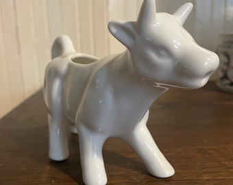 Cow milk jug. Cute cow shaped milk jug