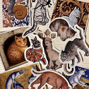 May include: A collection of vintage cat illustrations printed on stickers. The stickers feature cats in various poses, including a cat wearing a crown, a cat curled up in a shell, and a cat with a long tail. The stickers are printed on white paper with a slightly textured surface.