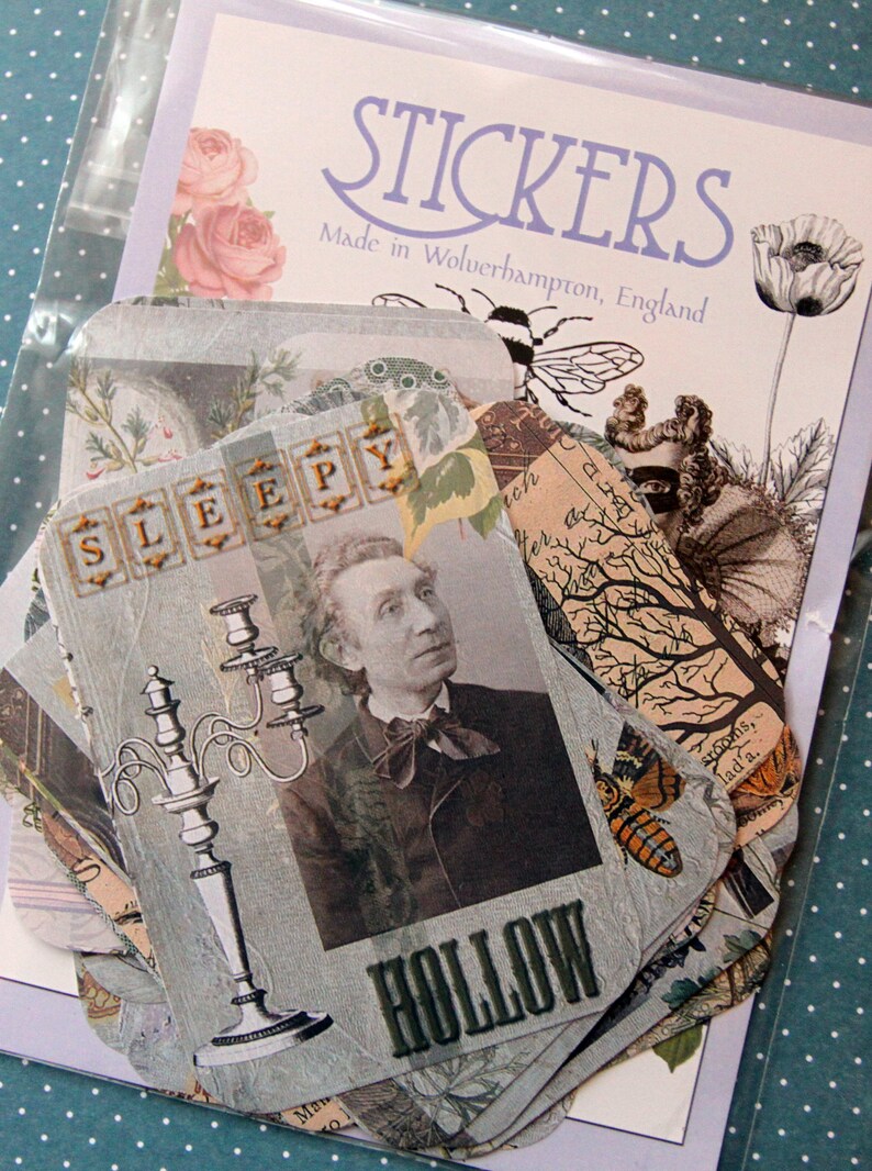 May include: A set of vintage-style stickers with a blue and white color scheme. The stickers feature illustrations of a candlestick, a tree, a butterfly, and a man with a mustache. The text "SLEEPY" and "HOLLOW" are featured on the stickers.