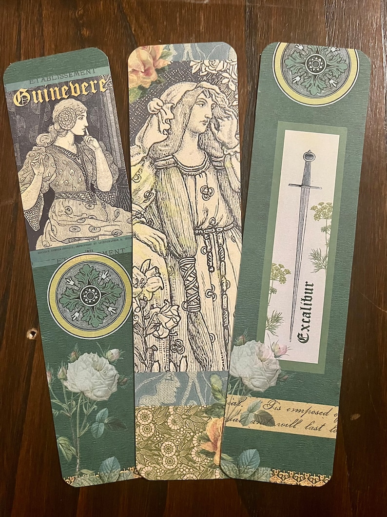 May include: Three bookmarks with a green background and floral designs. The first bookmark features a woman in a long dress with the text "Etablissement Guinevere". The second bookmark features a woman in a long dress with a floral design. The third bookmark features a sword with the text "Excalibur".