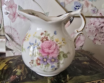 Pretty floral milk jug.