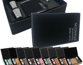 May include: A black leatherette gift box with a silver flask, two shot glasses, and a funnel. The flask is engraved with the initials "BGM" and the box is engraved with the text "10.01.2020  Groomsman  BRANDON".