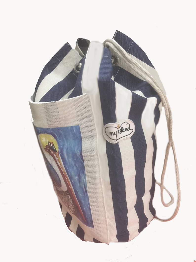 May include: A white and blue striped drawstring bag with a pelican illustration and a patch that says "my island".