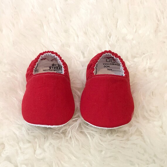 red baby shoes