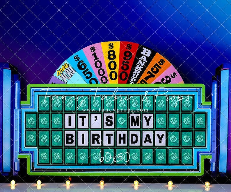 May include: A blue and green game show-themed backdrop with a spinning wheel and a large game board that says "IT'S MY BIRTHDAY".