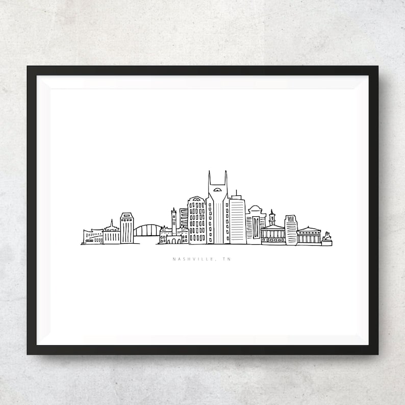 May include: A black and white line drawing of the Nashville skyline. The skyline includes the AT&T Building, the Ryman Auditorium, and the Country Music Hall of Fame. The text 'NASHVILLE, TN' is below the skyline.