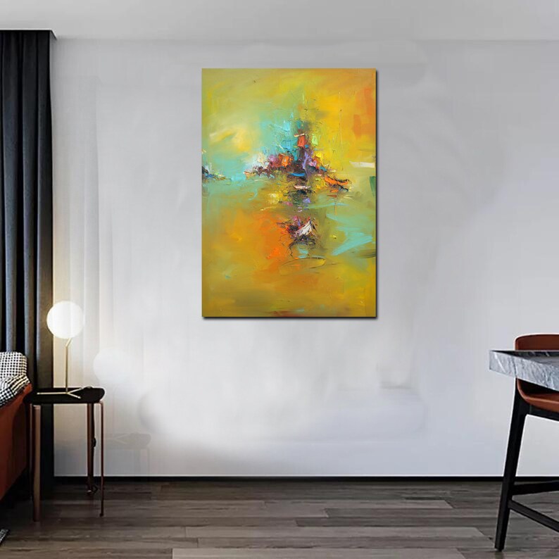 May include: Abstract painting with a yellow, orange, and green background. The painting features a central cluster of colourful shapes and lines.