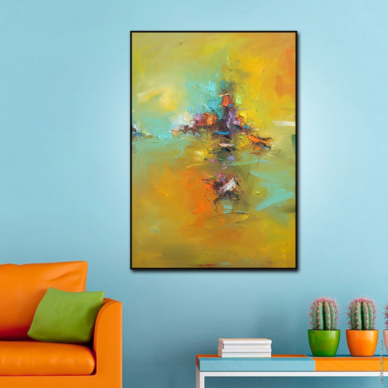 May include: Abstract painting with a yellow, orange, and green background. The painting features a cluster of colourful shapes in the centre, resembling a cityscape or a group of buildings.