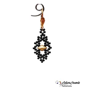 May include: Black beaded dangle earrings with a gold geometric bead in the center. The earrings have a silver hook closure.