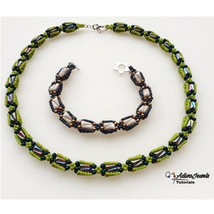 May include: A green and black beaded necklace and a white, brown, and black beaded bracelet. The necklace and bracelet are both made with small, faceted beads.