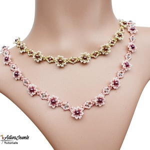 May include: Two beaded necklaces with flower-shaped charms. The top necklace is gold and white, and the bottom necklace is pink and white.